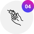 Hand holding a syringe